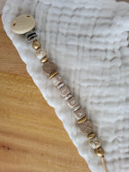 Attache-tétine relief beige