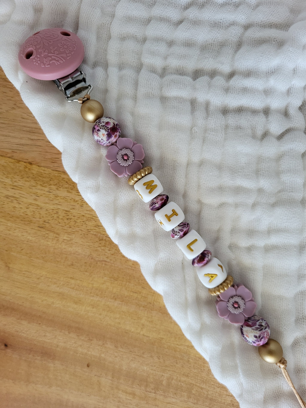 Attache-tétine rose clip relief