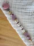 Attache-tétine rose clip relief
