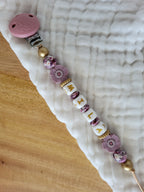 Attache-tétine rose clip relief