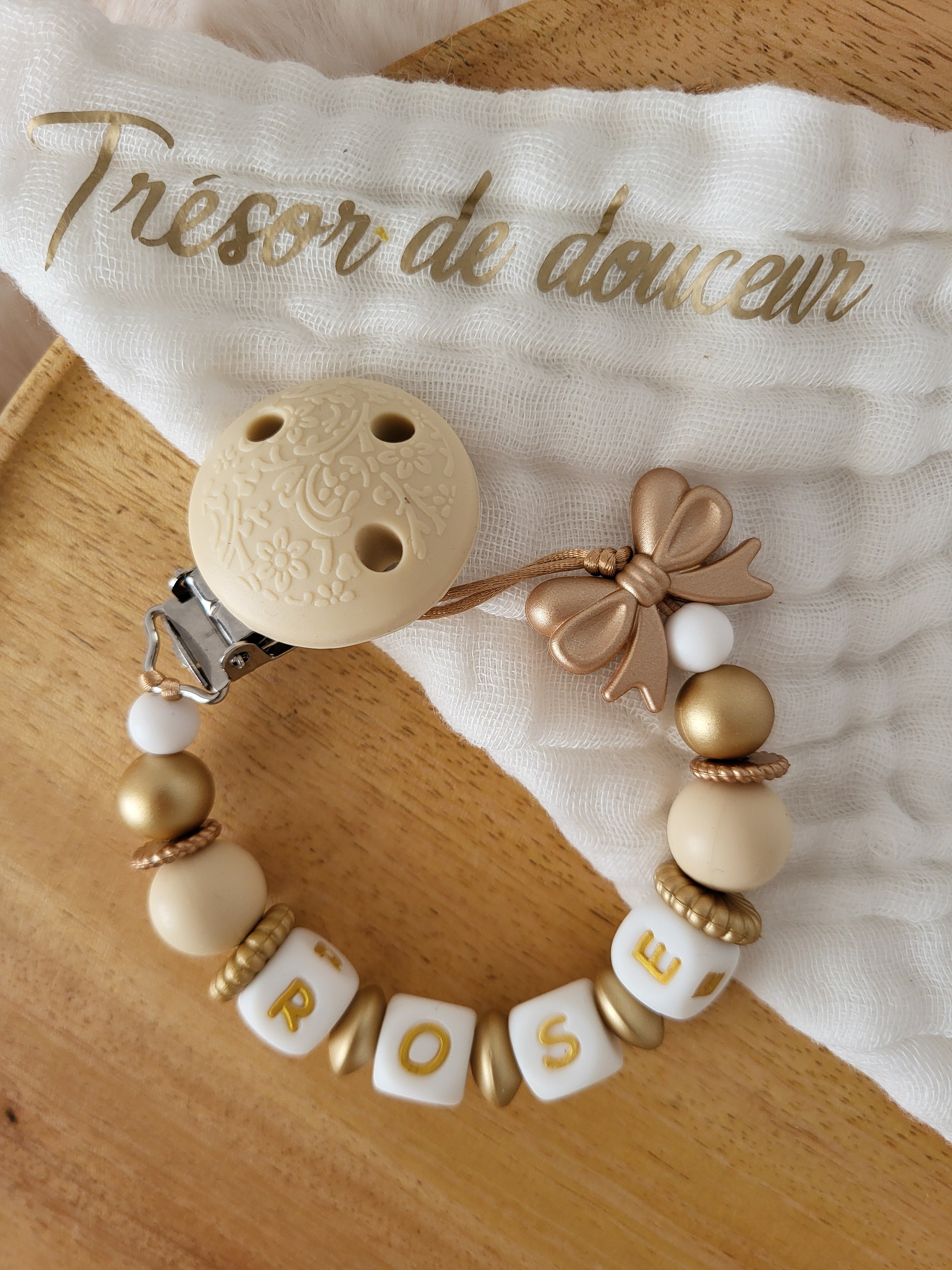 Attache-tétine fille noeud, beige et doré