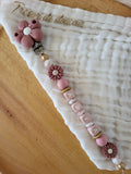 Attache-tétine fille marguerite rose