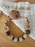 Attache-tétine fille marguerite beige