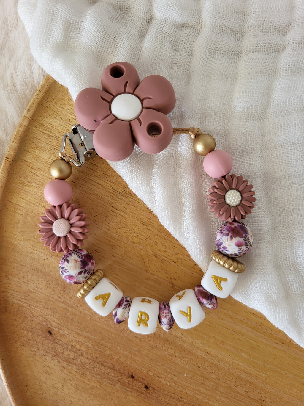 Attache-tétine fille marguerite rose
