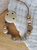 Attache-tétine relief beige