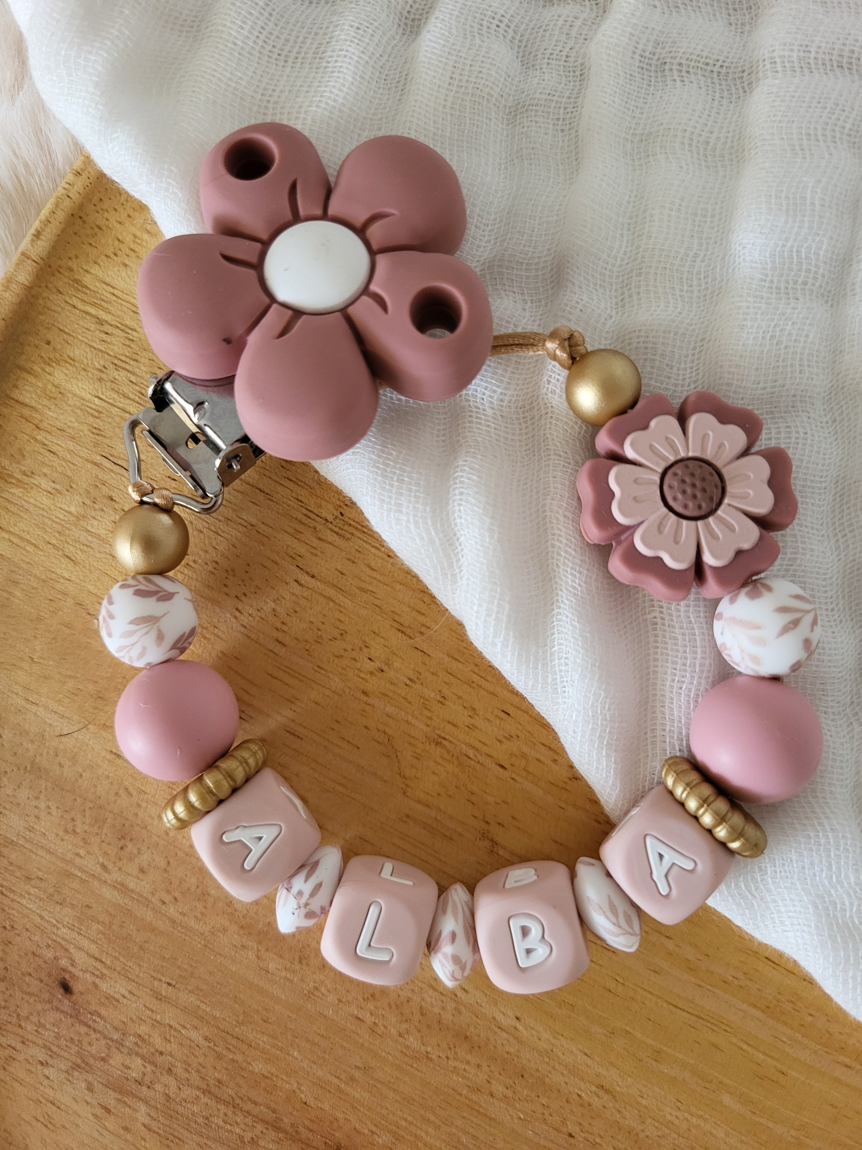 Attache-tétine fille marguerite rose