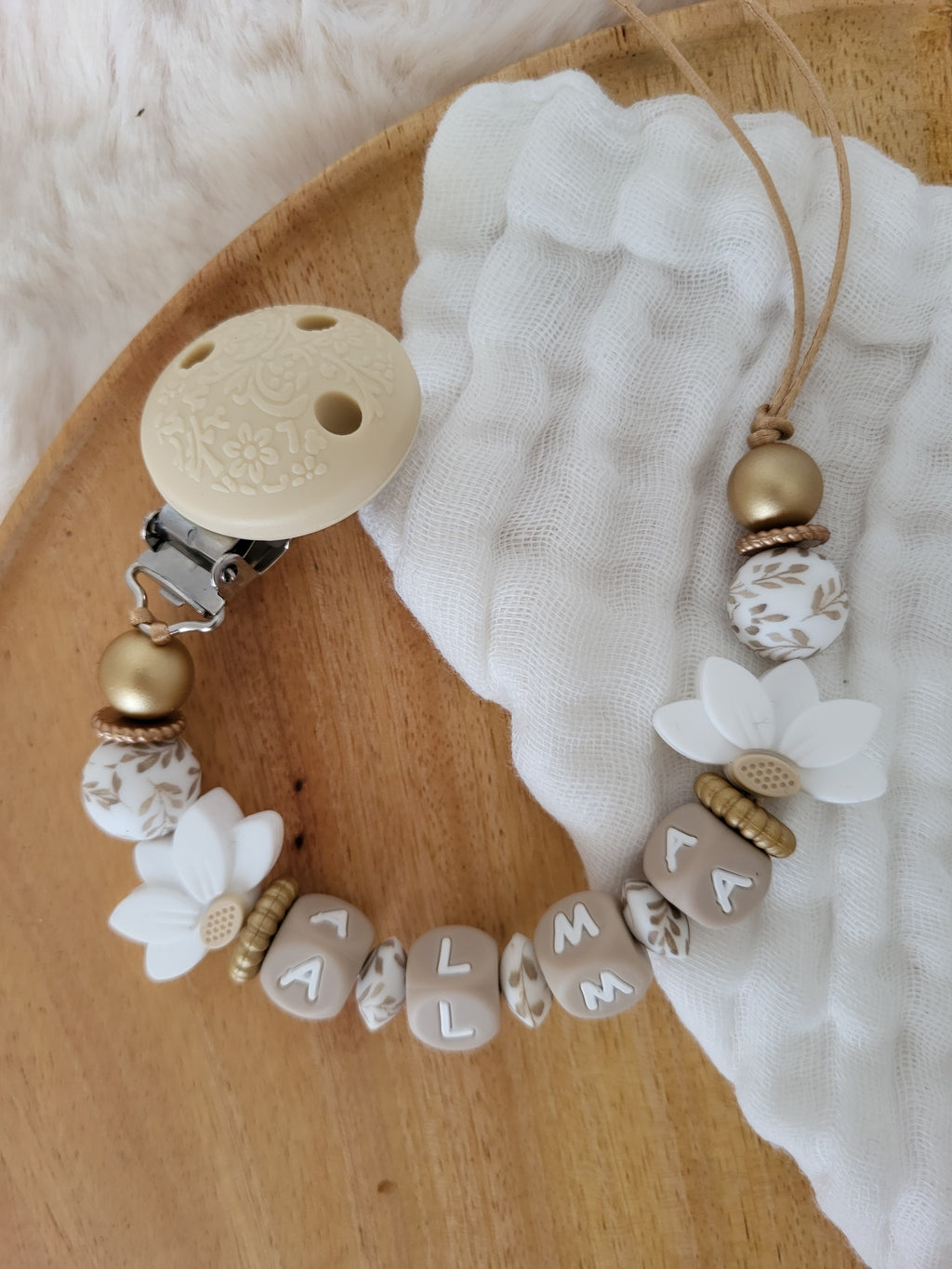 Attache-tétine lotus blanc